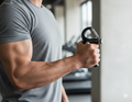 Flexora adjustable hand gripper with 5-60kg grip strength, featuring ergonomic design for effective hand and forearm exercise.
