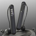 Flexora Smart Bluetooth Cordless Battle Rope for skipping, featuring sleek design and digital controls, ideal for fitness workouts.